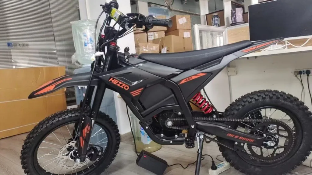 Starland D3 electric dirt bike parked in assembly workshop