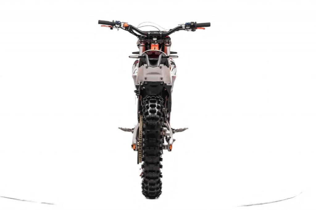 Starland F29 electric dirt bike in orange and white – rear view on white background