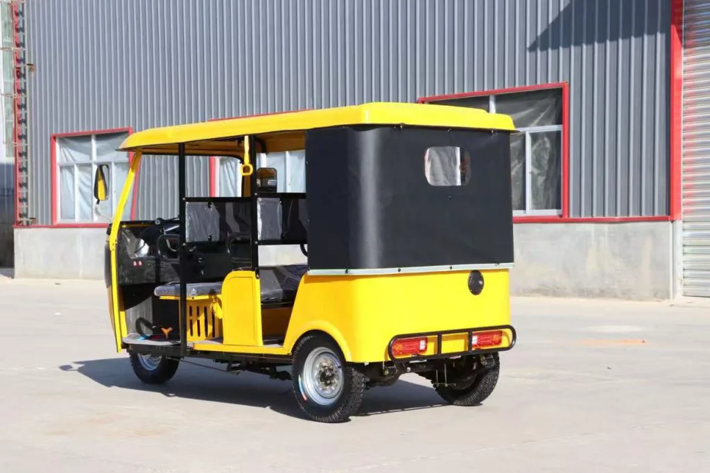 Three-row electric tuk tuk – rear view with steel roof