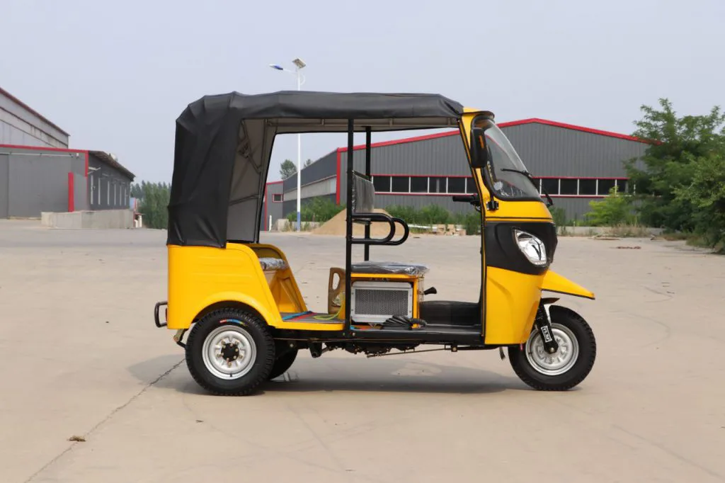 Two-row electric tuk tuk – side view at the factory