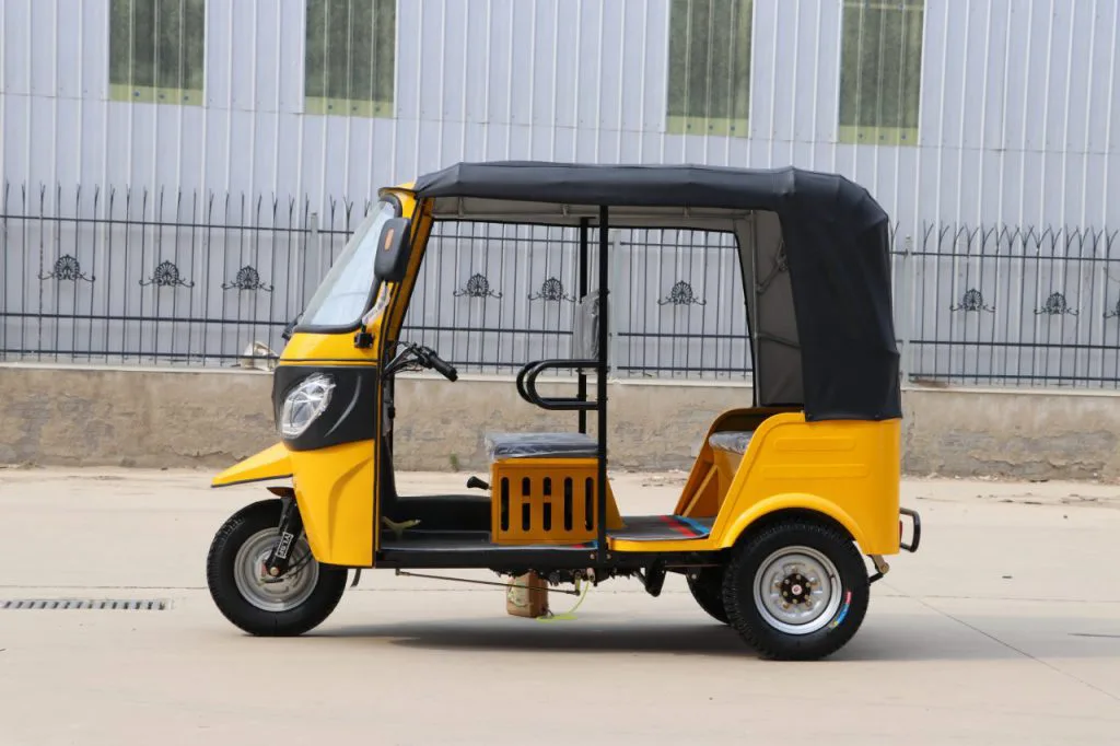 Two-row electric tuk tuk – parked view with enclosed cabin